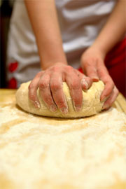 woman kneading dough